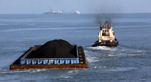 Currently coal companies use a two-step system, loading barges at the docks that then sail out to waiting ships where a floating crane transfers the coal onto the ships. The method will become illegal on Jan. 1, 2014. 