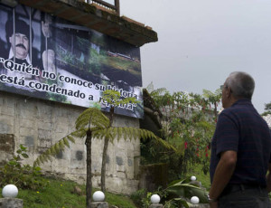 “Those who do not know their past are bound to repeat it,” reads a billboard with a picture of deceased drug trafficker Pablo Escobar in the prison known as “La Catedral,” where he was once held in the municipality of Envigado near the city of Medellín. (Raúl Arboleda/AFP)