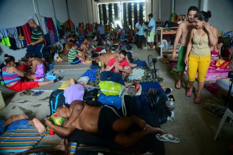 More than 1,200 Cubans are stranded in Colombia with hundreds of them housed in a warehouse in the port town of Turbo Raul Arboleda, --/AFP/File Read more: http://www.digitaljournal.com/news/world/colombia-adopts-measures-to-battle-migrant-crisis/article/471641#ixzz4GJYKPQuC 